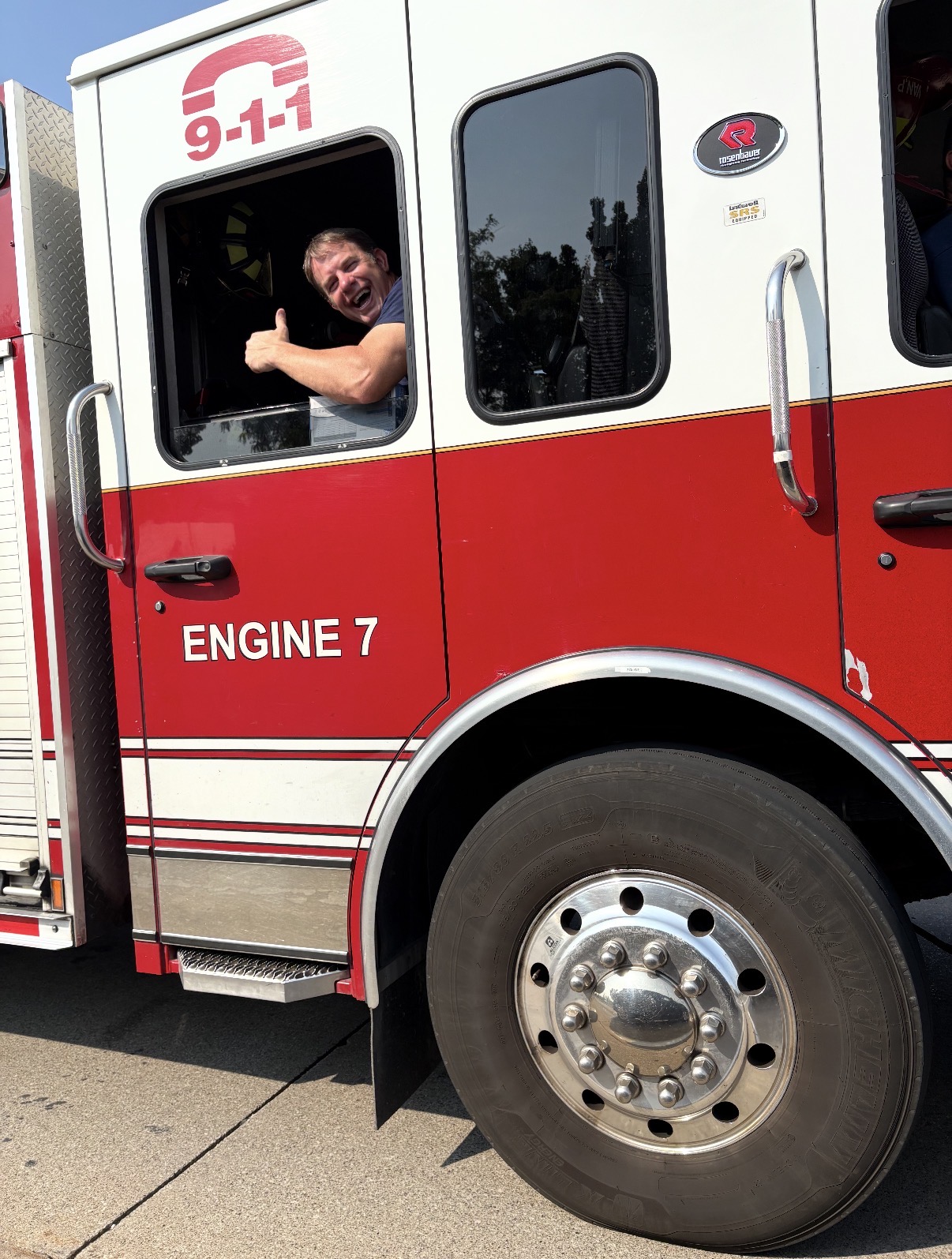 Michael Bryer, Windsor firefighter, giving a thumbs up from Engine 7